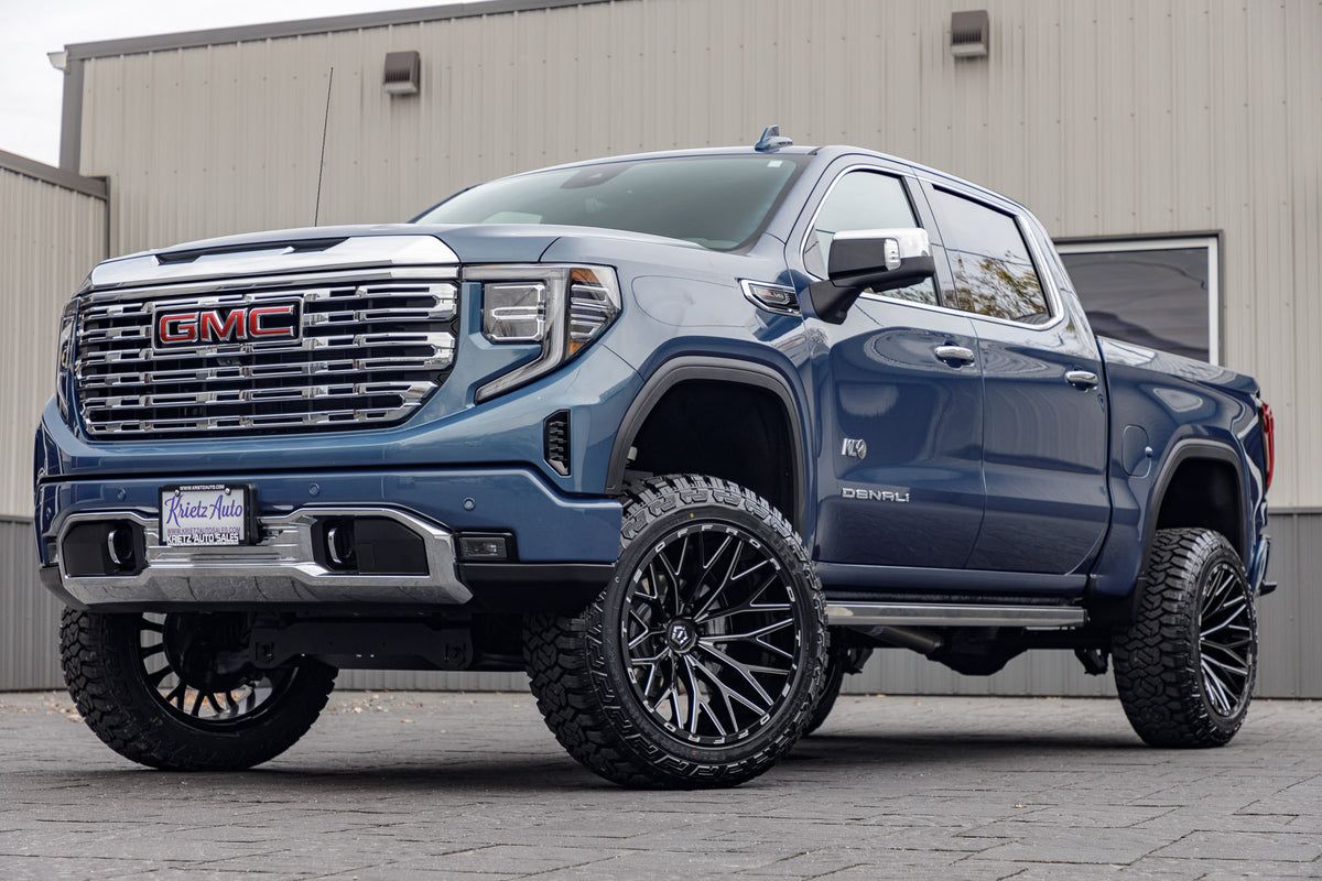 2024 GMC Sierra 1500 Denali with a 6" Rough Country lift kit, 22x12 TIS 566BM wheels, and 35" Fury Country Hunter R/T tires.