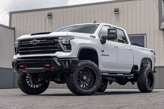 2025 Chevrolet Silverado 2500 LT with a 5" BDS lift kit, 22x12 TIS 547B wheels, and 37" Nitto Ridge Grappler tires.