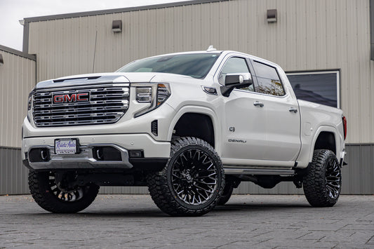 2023 GMC Sierra 1500 Denali with a 6" Rough Country suspension kit, 22x12 Fuel Strike wheels, and 35" Fury Country Hunter R/T tires.