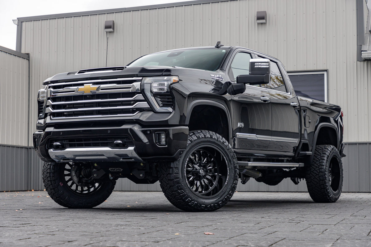 2024 Chevrolet Silverado 2500 High Country with a 5" BDS lift kit, 22x12 Fuel Arc wheels, and 37" Nitto Ridge Grappler tires.