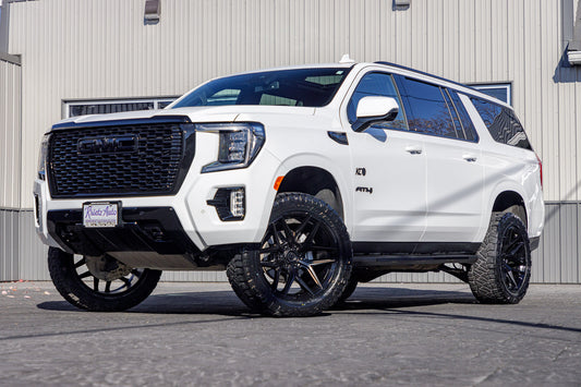 2024 GMC Yukon XL AT4 with a 3" ReadyLift lift kit, 22x10 Fuel Flux wheels, and 295/50 Nitto Ridge Grappler tires.