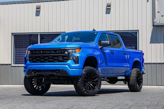 2025 Chevrolet Silverado 1500 Custom with a 6" Rough Country lift kit, 22x12 Fuel Rebar wheels, and 35" Fury Country Hunter R/T tires.