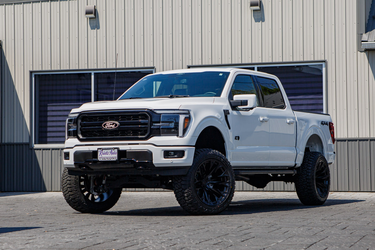 2025 Ford F-150 Lariat with a 6" Rough Country lift kit, 22x12 Fuel Flame wheels, and 35" Fury Country Hunter R/T tires.