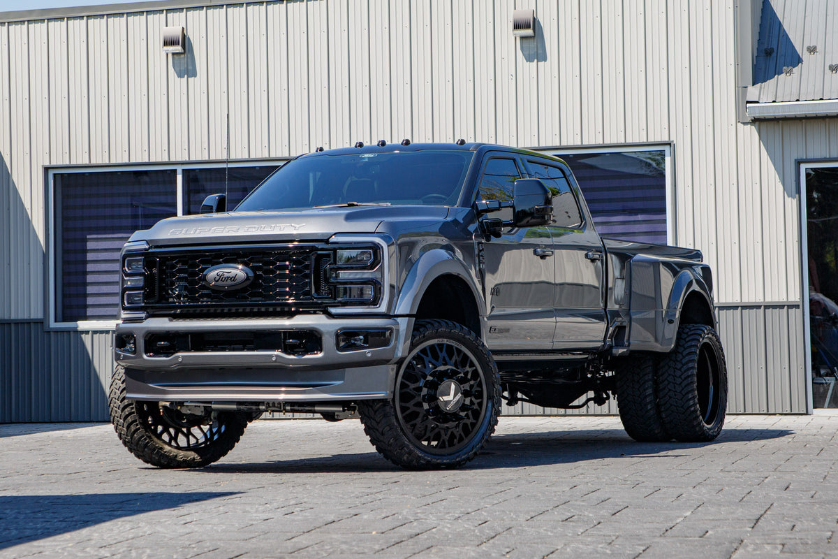 2026 Ford F-450 Super Duty Platinum with a 4" Wicked lift kit, 26x8.25 KG1 Torture wheels, and 37" AMP Terrain Attack M/T A tires.