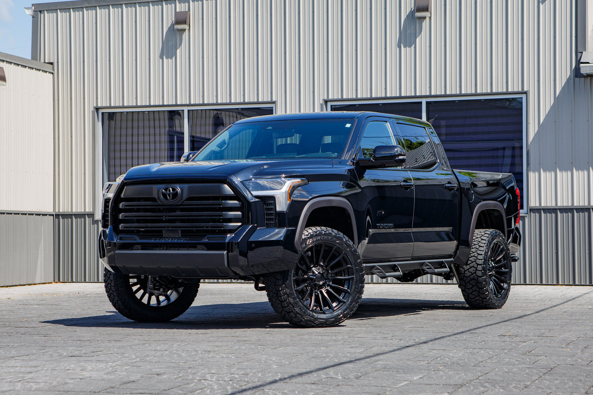2026 Toyota Tundra SR5 with a 6" Rough Country lift kit, 22x10 Fuel Blade wheels, and 285/55 Toyo Open Country R/T Trail tires.