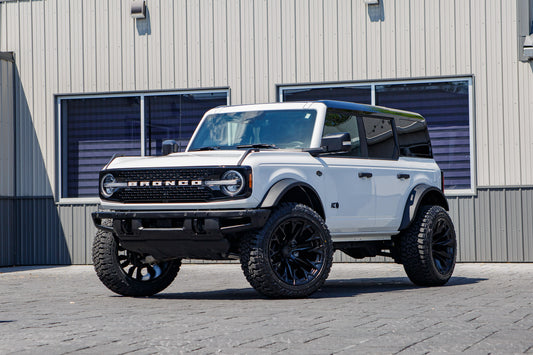 2024 Ford Bronco Wildtrak with a 2.25 Zone lift kit, 22x12 Fuel Flame wheels, and 35" Fury Country Hunter R/T tires.
