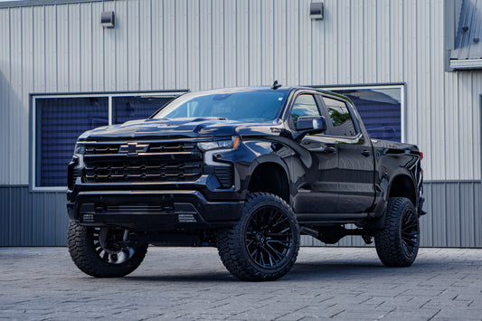 2026 Chevrolet Silverado 1500 LT Trail Boss with a 6" Rough Country lift kit, 22x12 Fuel Rebar wheels, and 35" Fury Country Hunter R/T tires.