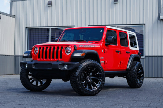2021 Jeep Wrangler Unlimited Sport S with a 2.5" Rough Country lift kit, 22x12 Fuel Flame wheels, and 35" Fury Country Hunter R/T tires