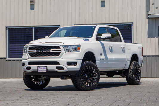 2023 Ram 1500 Big Horn with a 6" Rough Country lift kit, 22x12 Fuel Strike wheels, and 35" Fury Country Hunter R/T tires.