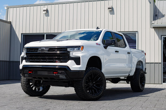 2025 Chevrolet Silverado 1500 LT Trail Boss with a 6" Rough Country lift kit, 22x12 Fuel Rebar wheels, and 35" Avix Trailtek R/T tires.