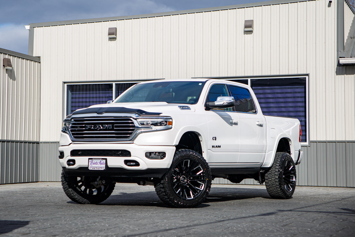 2024 Ram 1500 Limited Longhorn with a 6" Rough Country lift kit, 22x12 Fuel Rebar wheels, and 35" Fury Country Hunter R/T tires.
