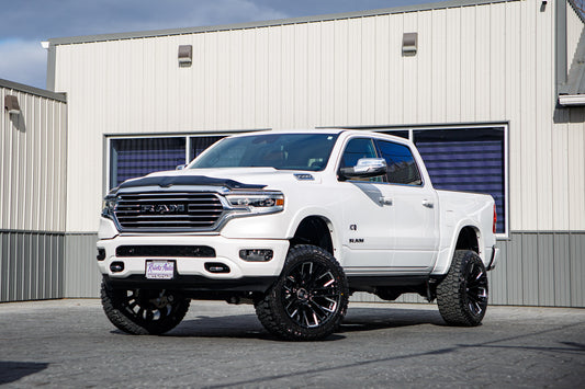 2024 Ram 1500 Limited Longhorn with a 6" Rough Country lift kit, 22x12 Fuel Rebar wheels, and 35" Fury Country Hunter R/T tires.
