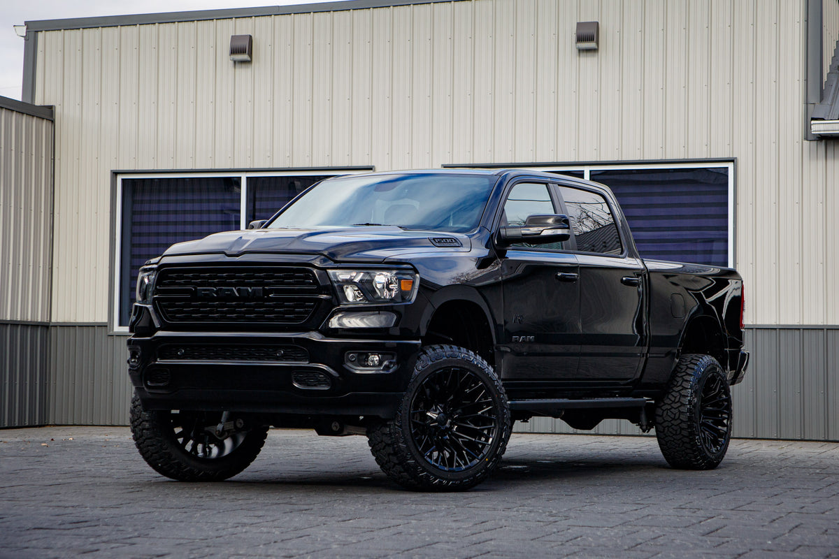 2022 Ram 1500 Big Horn with a 6" Rough Country lift kit, 22x12 Fuel Strike wheels, and 35" Fury Country Hunter R/T tires.
