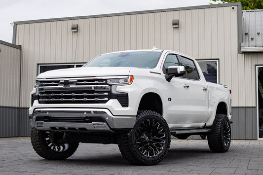 2023 Chevrolet Silverado 1500 LTZ with a 6" Rough Country lift kit, 22x12 Fuel Strike wheels, and 35" Avix Trailtek R/T tires.