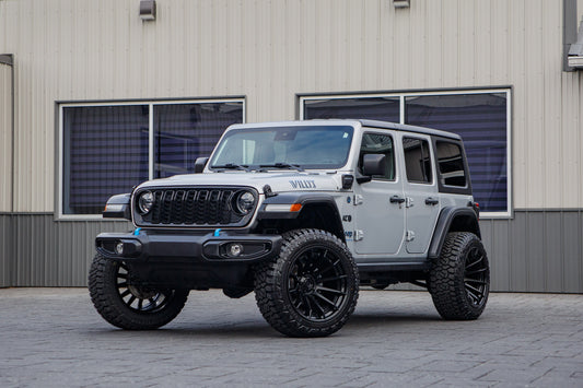 2024 Jeep Wrangler Sport S 4XE with a 2.5" Rough Country lift kit, 22x12 Fuel Burn wheels, and 35" Fury Country Hunter R/T tires.