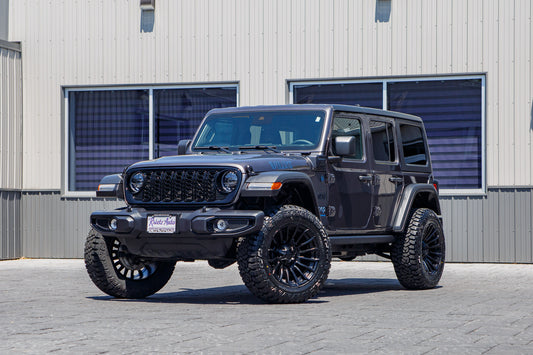 2025 Jeep Wrangler Willys 4XE with a Rough Country lift kit, 20x10 Fuel Blade wheels, and 35" Fury Country Hunter R/T tires.