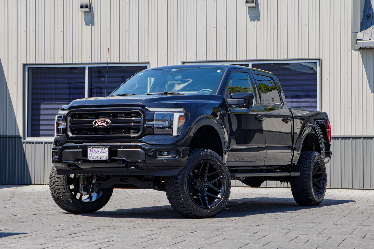 2025 Ford F-150 Lariat with a 6" Rough Country lift kit, 22x12 Fuel Flux wheels, and 35" Fury Country Hunter R/T tires.