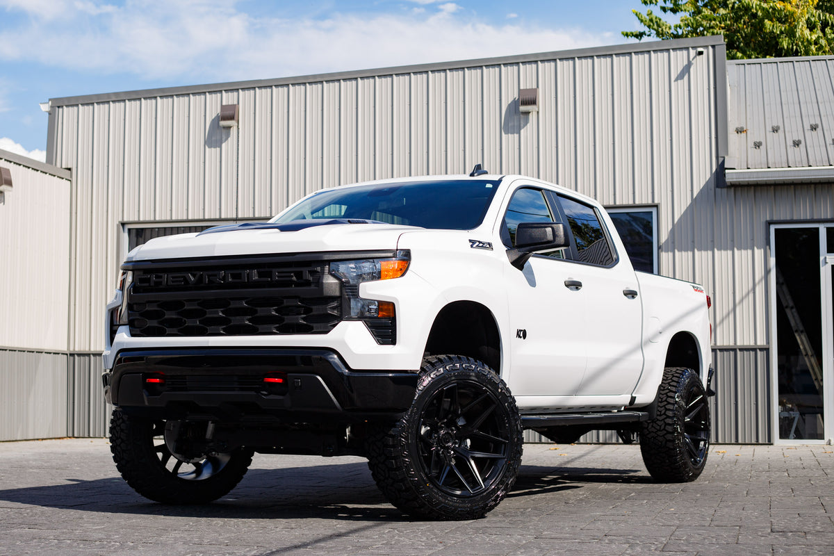 2024 Chevrolet Silverado 1500 Custom Trail Boss with a 6" Rough Country lift kit, 22x12 Fuel Flux wheels, and 35" Fury Country Hunter R/T tires.