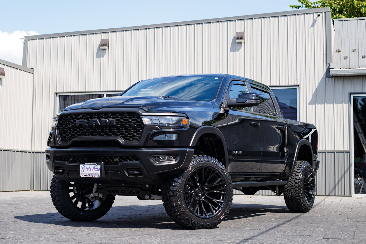 2025 Ram 1500 Rebel with a 6" Rough Country lift kit, 22x12 Fuel Rebar wheels, and 35" Fury Country Hunter R/T tires.
