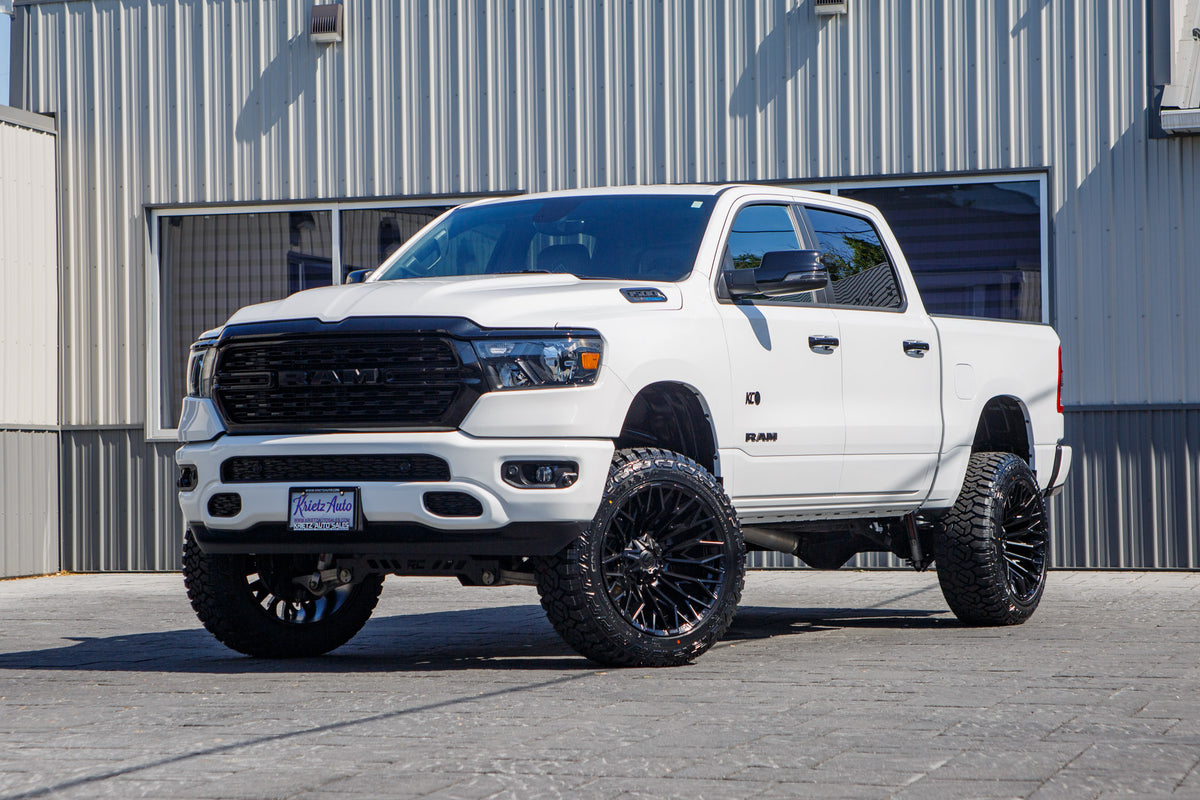 2023 Ram 1500 Big Horn with a 6" Rough Country lift kit, 22x12 Fuel Strike wheels, and 35" Fury Country Hunter R/T tires.