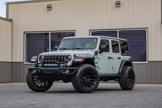 2023 Jeep Wrangler Rubicon 4XE with Jeep Stock suspension, 22x12 Fuel Burn wheels, and 35" Fury Country Hunter R/T tires.