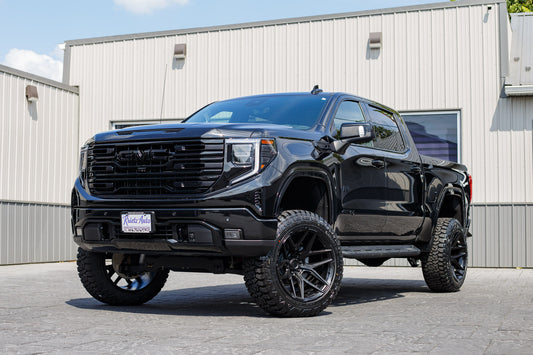 2025 GMC Sierra 1500 AT4 with a 6" Rough Country lift kit, 22x12 Fuel Flux wheels, and 35" Fury Country Hunter R/T tires.