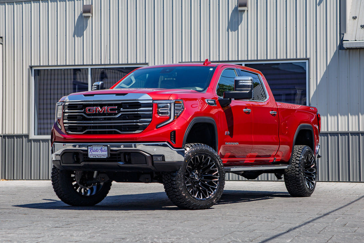 2025 GMC Sierra 1500 SLT with a 6" Rough Country lift kit, 22x12 Fuel Strike wheels, and 35" Fury Country Hunter R/T tires.