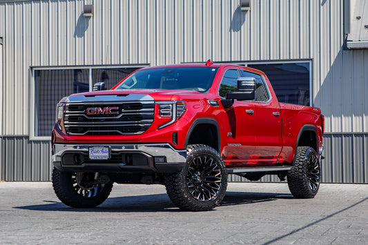 2025 GMC Sierra 1500 SLT with a 6" Rough Country lift kit, 22x12 Fuel Strike wheels, and 35" Fury Country Hunter R/T tires.
