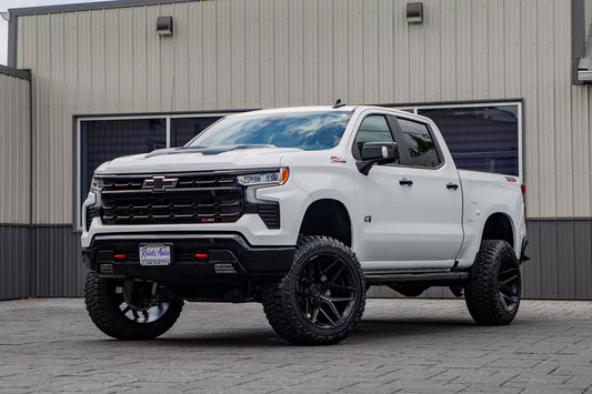 2026 Chevrolet Silverado 1500 LT Trail Boss with a 6" Rough Country lift kit, 22x12 Fuel Flux wheels, and 35" Fury Country Hunter R/T tires.