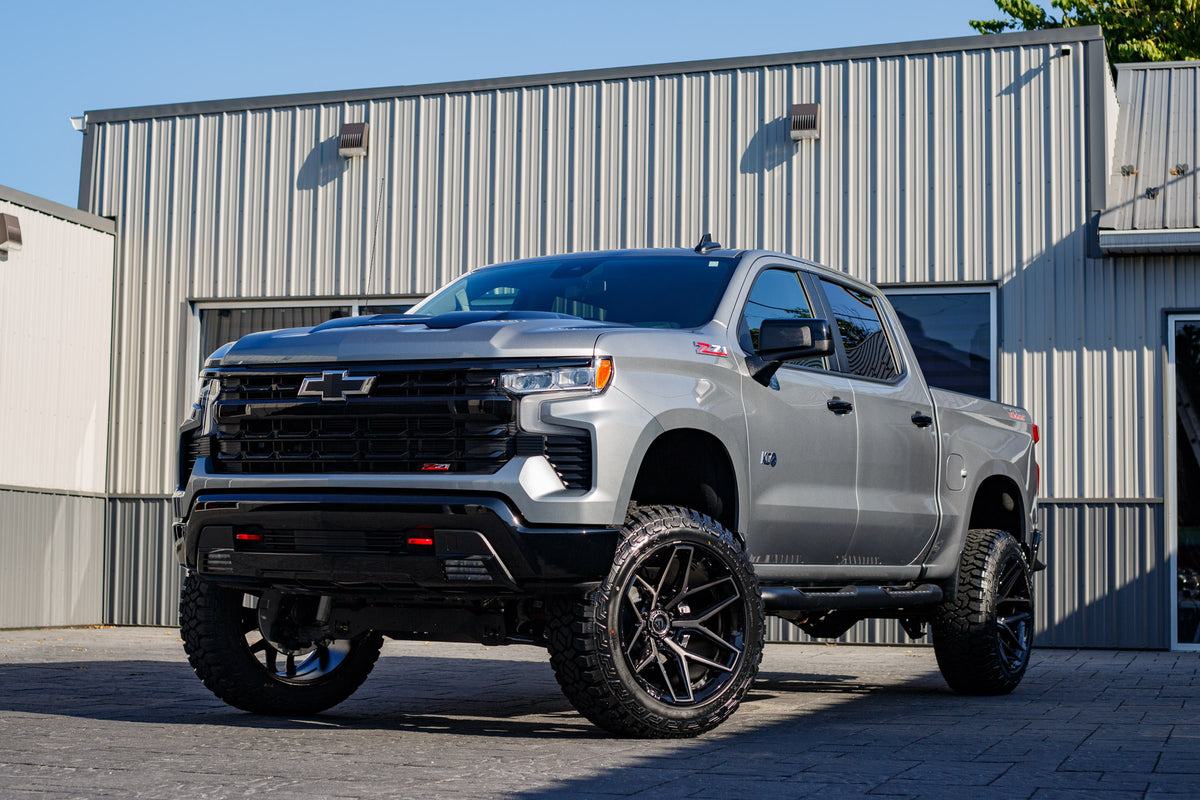 2025 Chevrolet Silverado 1500 LT Trail Boss with a 6" Rough Country lift kit, 22x12 Fuel Flux wheels, and 35" Avix Trailtek tires.