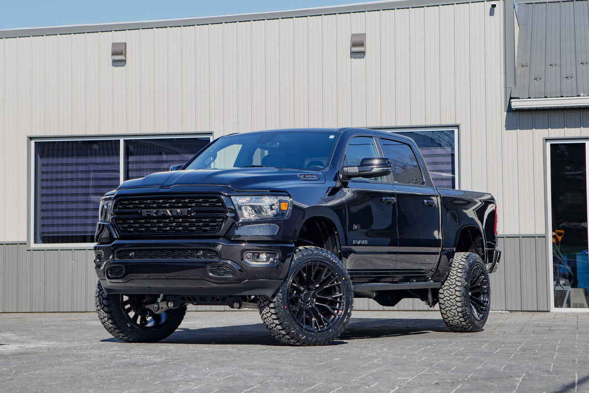 2023 Ram 1500 Big Horn with a 6" Rough Country lift kit, 22x12 Fuel Rebar wheels, and 35" Fury Country Hunter R/T tires.