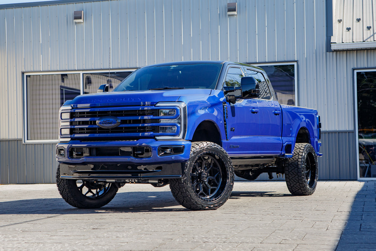 2026 Ford F-350 Super Duty Platinum with a 4" Wicked lift kit, 24x12 American Force Cortex wheels, and 325/45 Nitto Recon Grappler tires.