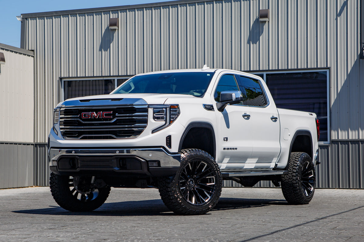 2026 GMC Sierra 1500 SLT with a 6" Rough Country lift kit, 22x12 Fuel Rebar wheels, and 35" Fury Country Hunter R/T tires.