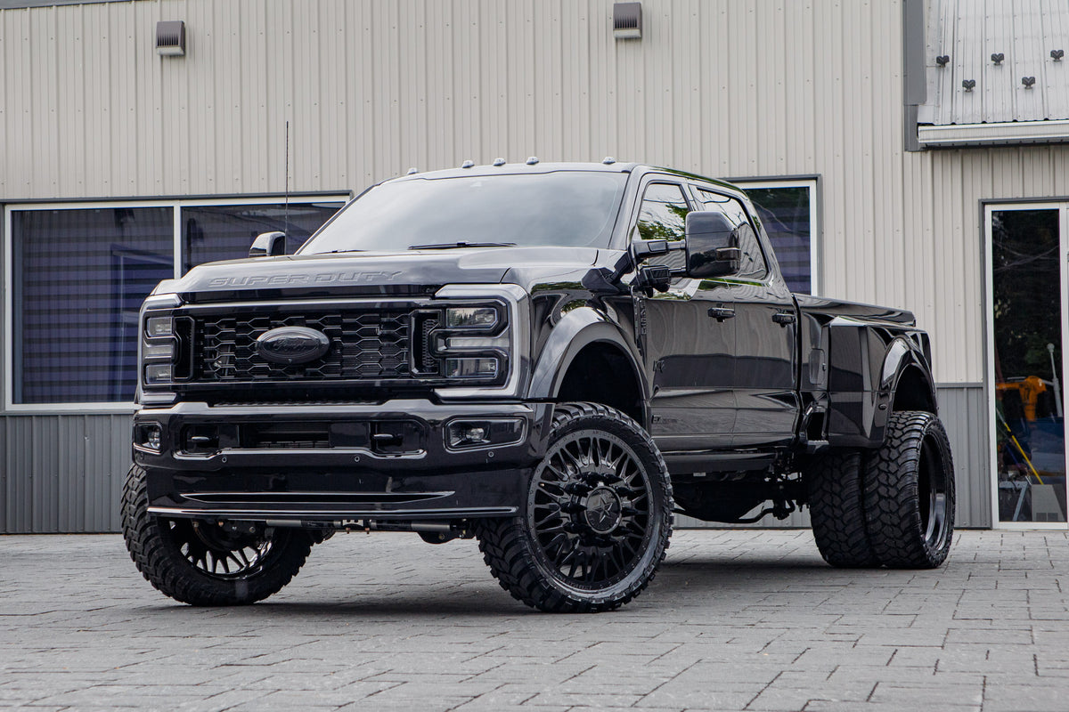 2026 Ford F-450 Super Duty Platinum with a 4" Wicked lift kit, 26x8.25 American Force Plague wheels, and 37" AMP Terrain Attack M/T A tires.