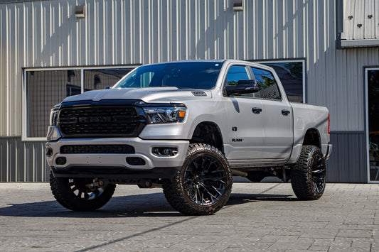 2023 Ram 1500 Big Horn with a 6" Rough Country lift kit, 22x12 Fuel Flame wheels, and 35" Fury Country Hunter R/T tires.