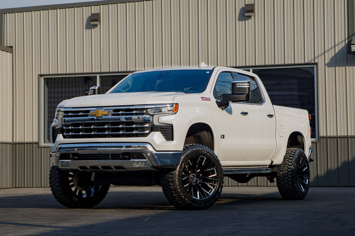 2025 Chevrolet Silverado 1500 LTZ with a 6" Rough Country lift kit, 22x12 Fuel Rebar wheels, and 35" Fury Country Hunter R/T tires.