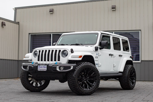 2023 Jeep Wrangler Sahara 4XE with a 2.5" Rough Country lift kit, 22x12 Fuel Rebar wheels, and 35" Avix Trailtek R/T tires.