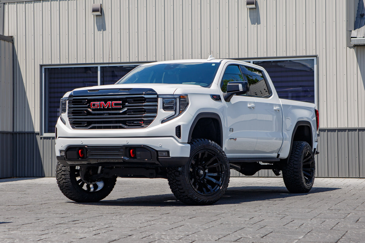 2026 GMC Sierra 1500 AT4 with a 6" Rough Country lift kit, 22x12 Fuel Blitz wheels, and 35" Fury Country Hunter R/T tires.