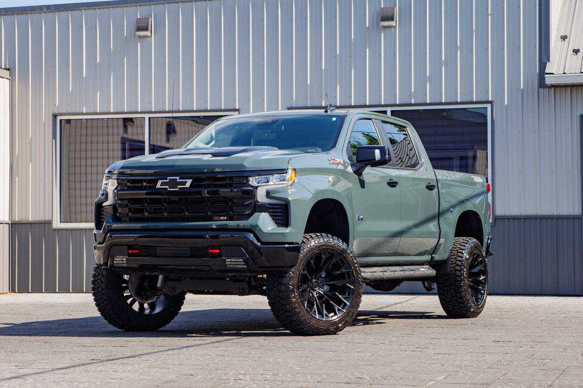 2026 Chevrolet Silverado 1500 LT Trail Boss with a 6" Rough Country lift kit, 22x12 Fuel Flame wheels, and 35" Fury Country Hunter R/T tires.