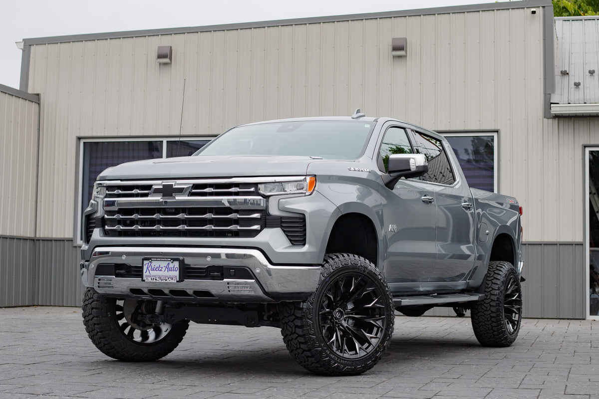 2025 Chevrolet Silverado 1500 LTZ with a 6" Rough Country lift kit, 22x12 Fuel Flame wheels, and 35" Fury Country Hunter tires.