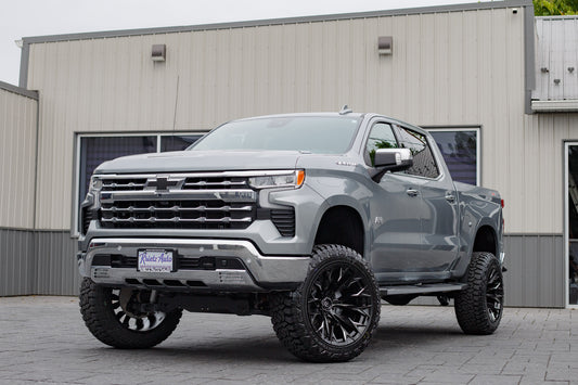 2025 Chevrolet Silverado 1500 LTZ with a 6" Rough Country lift kit, 22x12 Fuel Flame wheels, and 35" Fury Country Hunter tires.