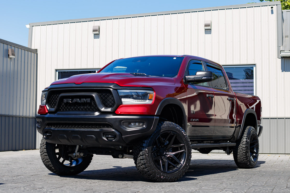 2023 Ram 1500 Rebel with a 6" Rough Country lift kit, 22x12 Fuel Flux wheels, and 35" Fury Country Hunter R/T tires.