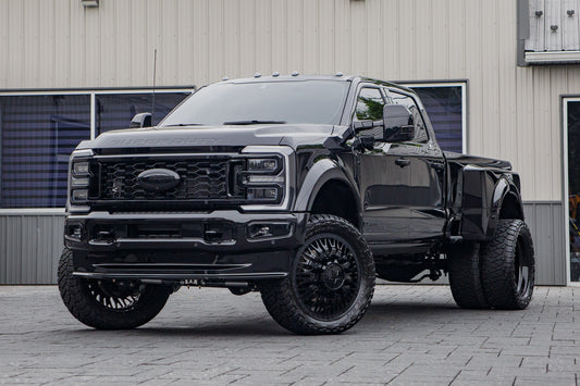 2026 Ford F-450 Super Duty Platinum with a 4" Wicked lift kit, 26x8.25 American Force Shrapnel wheels, and 37" AMP Terrain Attack M/T A tires.