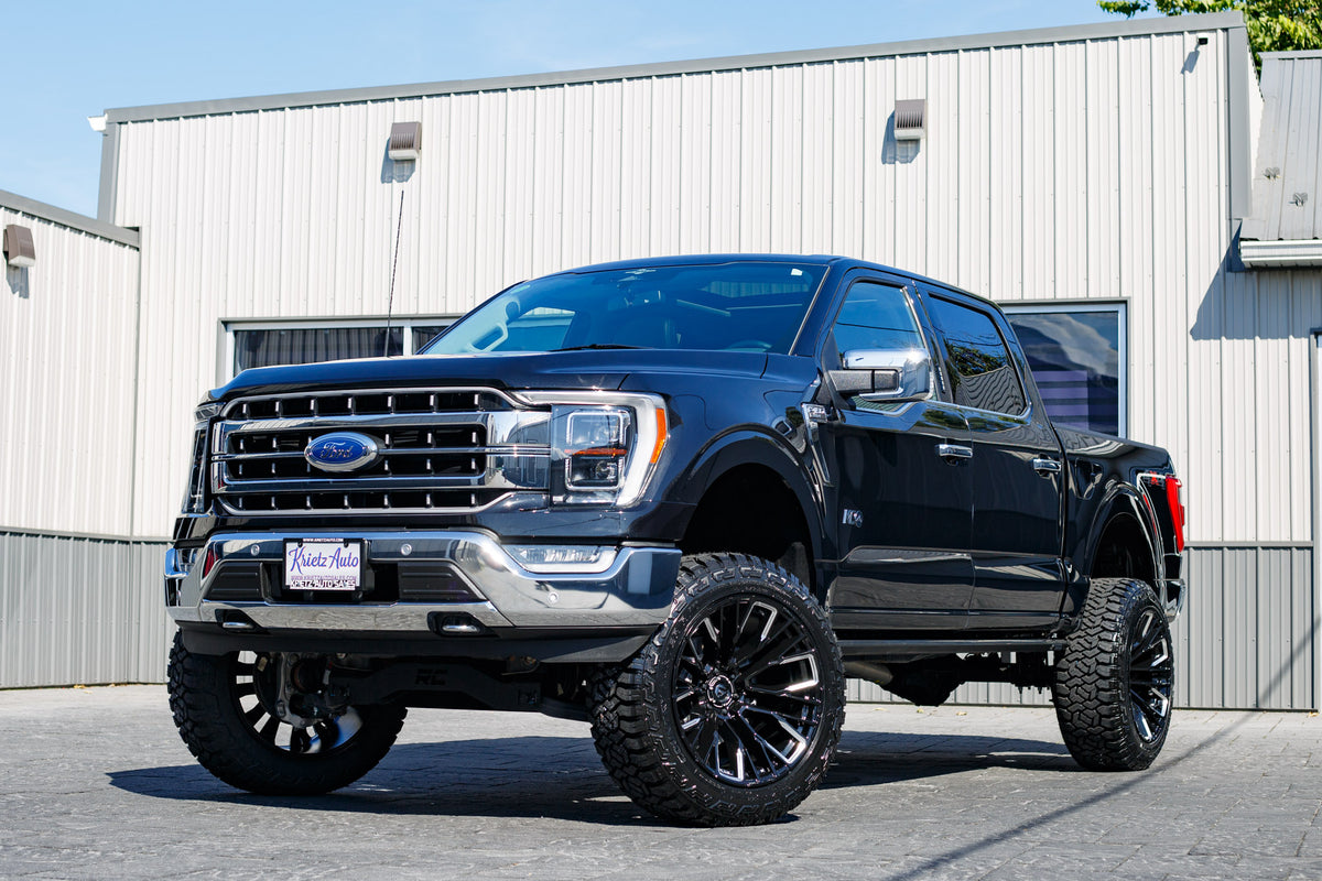 2023 Ford F-150 XLT with a 6" Rough Country lift kit, 22x12 Fuel Rebar wheels, and 35" Fury Country R/T tires.