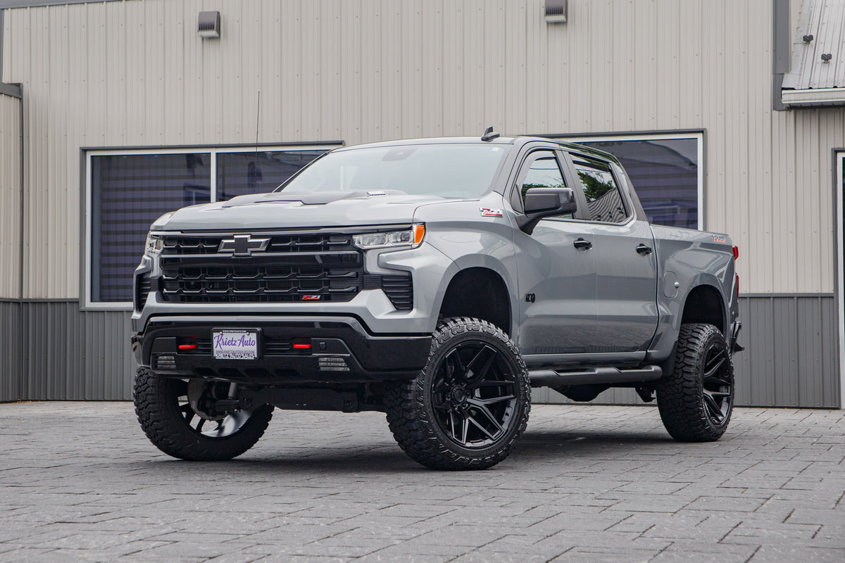2025 Chevrolet Silverado 1500 LT Trail Boss with a 6" Rough Country lift kit, 22x12 Fuel Flux wheels, and 35" Fury Country Hunter R/T tires.