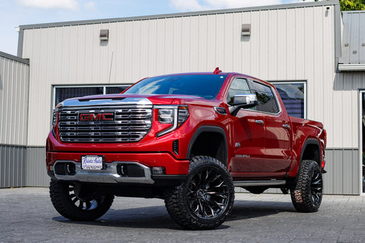 2022 GMC Sierra 1500 Denali with a 6" Rough Country lift kit, 22x12 Fuel Flame wheels, and 35" Nitto Ridge Grappler tires.