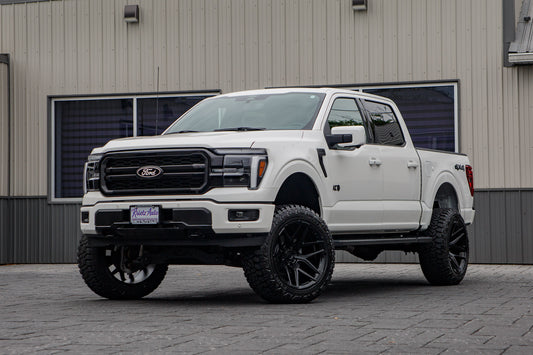 2026 Ford F-150 Lariat with a 6" Rough Country lift kit, 22x12 Fuel Flux wheels, and 35" Fury Country Hunter R/T tires.