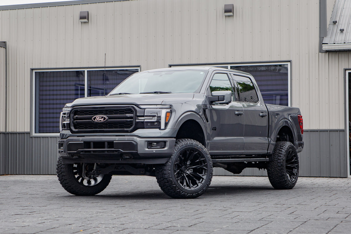 2026 Ford F-150 Lariat with a 6" Rough Country lift kit, 22x12 Fuel Flame wheels, and 35" Fury Country Hunter R/T tires.