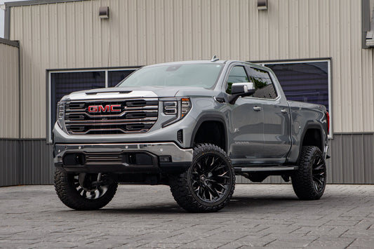 2026 GMC Sierra 1500 SLT with a 6" Rough Country lift kit, 22x12 Fuel Flame wheels, and 35" Fury Country Hunter R/T tires.