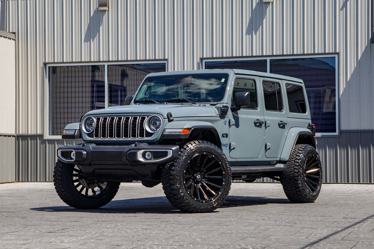 2025 Jeep Wrangler Sahara 4XE with a 2.5" Rough Country lift kit, 22x12 Hostile H123 wheels, and 35" Fury Country Hunter R/T tires.